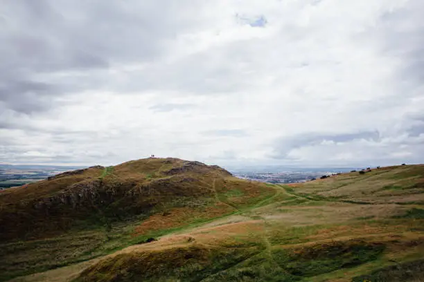 Photo of Silhouettes on the Hillside of Arthur's Seat near Edinburgh, Scotland
