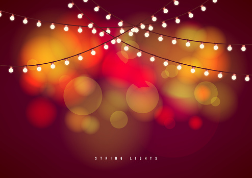 Bokeh background with outdoor string lights. Party glowing light bulbs background.