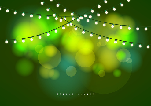 Bokeh background with outdoor string lights. Party glowing light bulbs background.