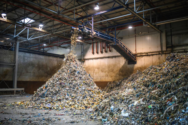 istock Piles of Separated Recyclables Inside Waste Facility 1285181677