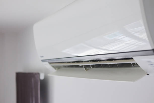 istock Air conditioner on white wall room interior background 1285181709