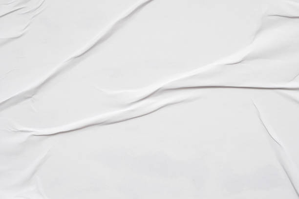 istock Blank white crumpled and creased paper poster texture background 1285181829
