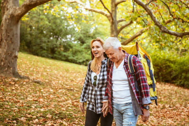 istock Middle aged couple hiking with backpacks 1285184015