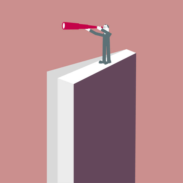 istock A man stands on the book and observes with a telescope. 1285184900