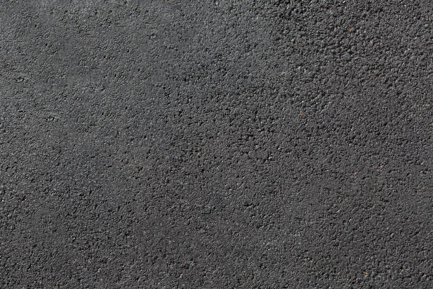 istock texture new tarmac road surface pedestrian pavement without marking smooth dark gray asphalt with copy space, nobody. 1285185033