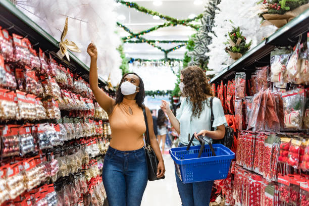 istock Women shopping for Christmas ornaments 1285185577