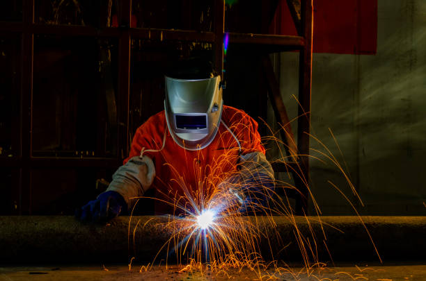 istock Close-up Industrial Worker at the factory welding . 1285187553
