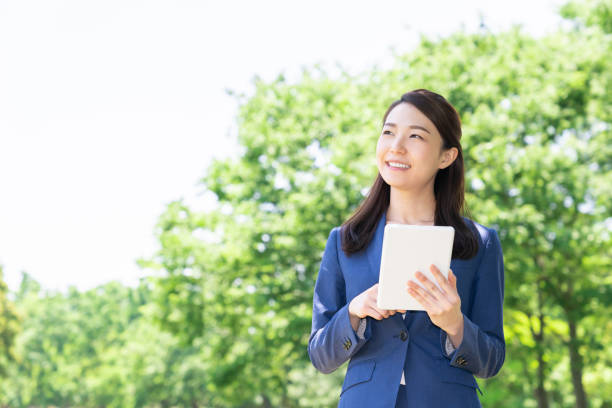 istock asian woman who see a tablet computer 1285188717