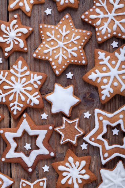 istock Gingerbread Christmas cookies full frame on wooden table. 1285189961