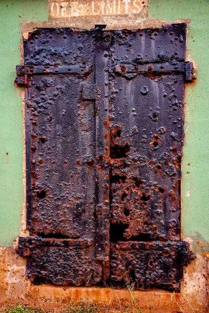 istock Rusty door says no entry on deserted WWII base 1285189978
