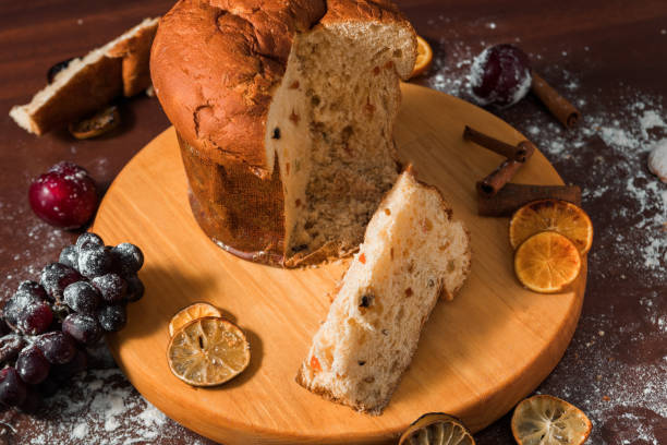 istock Traditional Christmas panettone with dried fruits on rustic background. 1285192555