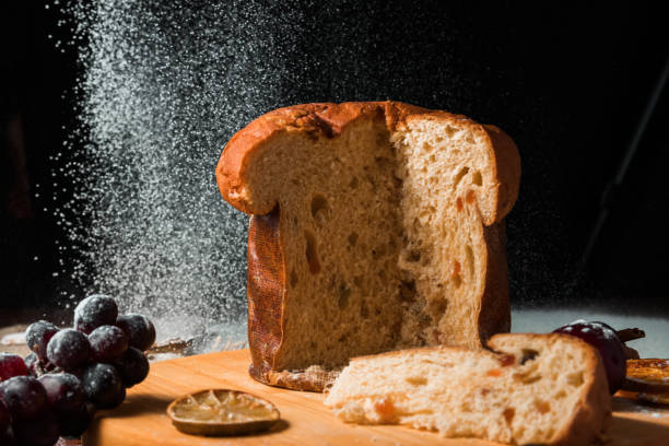 istock Christmas cake panettone and christmas decorations on dark background. 1285193285