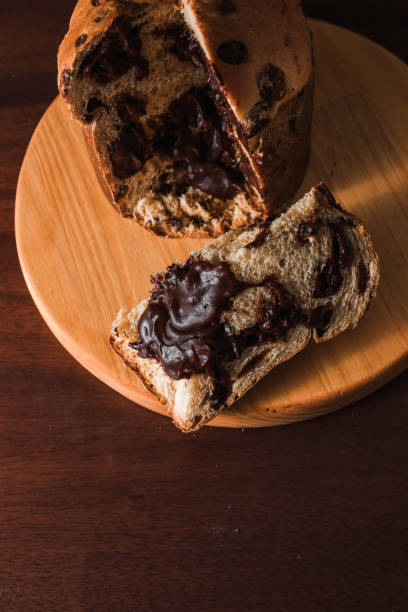 istock Chocolate panettone slice on dark background. 1285195634