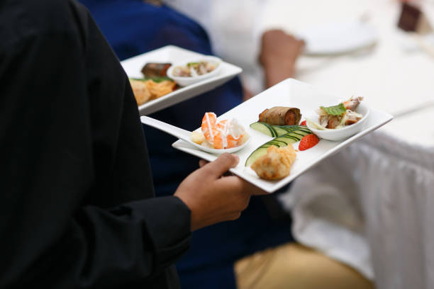 istock Waiter carrying plates with meat dish 1285202305