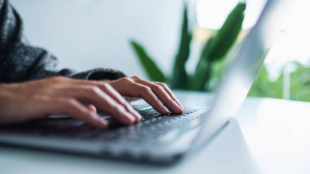 istock a woman working and typing on laptop computer keyboard on the table 1285206822