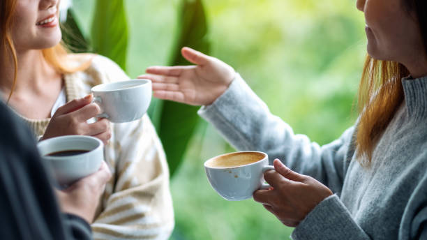 istock people enjoyed talking and drinking coffee together 1285206827