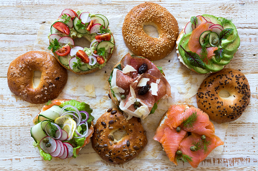 Bagel sandwiches on paper.