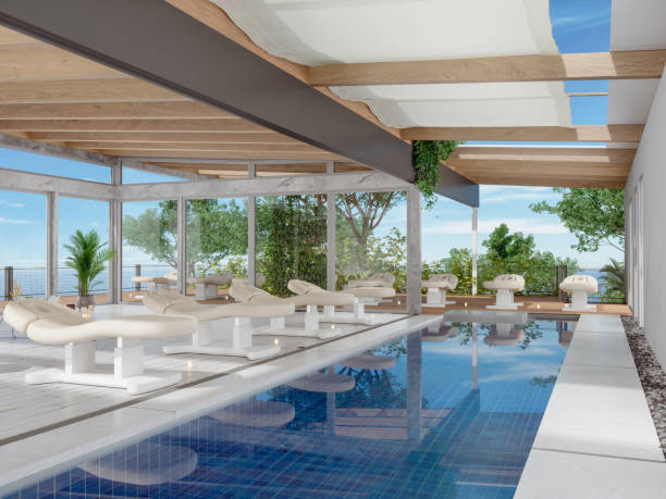 istock Luxury Spa Hotel With Deck Chairs, Swimming Pool And Seaview Background 1285209281