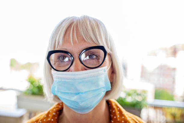 istock Mature Woman Wearing a Mask 1285209392