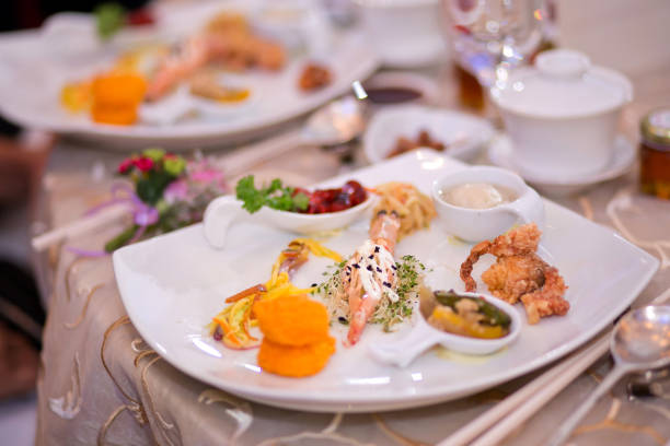 Round table of Chinese food serving during a wedding reception in Malaysia. Soft focus image.