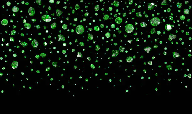 Photo of Falling lot of green emeralds on a black background. Clipping path included.