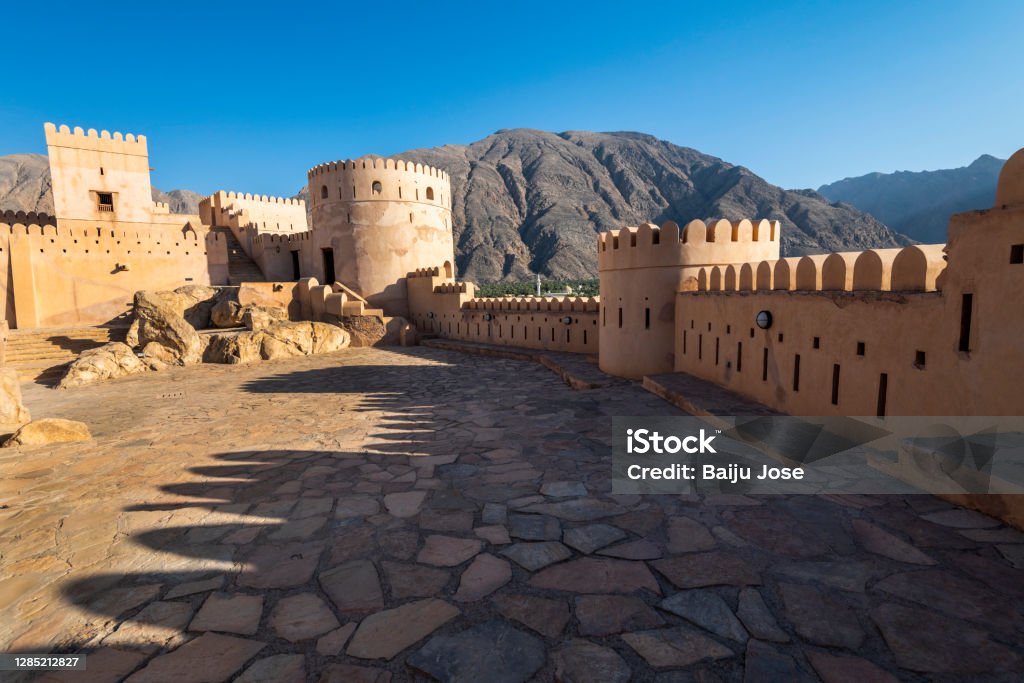 Nakhal Fort,Nakhal,Sultanate of Oman. Nakhal Fort is a large fortification in Al Batinah Region of Oman.Built on the foundations of a pre-Islamic structure, the towers and entrance of this fort were constructed during the reign of Imam Said Bin Sultan in 1834. Fort Stock Photo