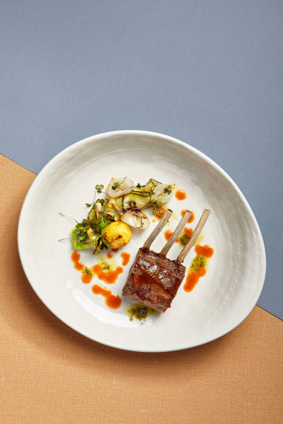 istock Rack of lamb in white deep plate top view 1285212956