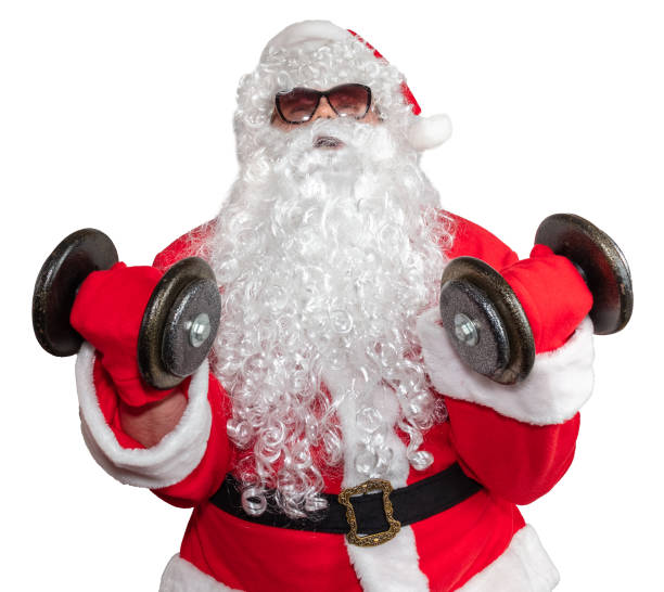 istock Santa Claus working out with two dumbbells and doing bicep curls. Santa is pushing it really hard. Santa wearing sunglasses and a long white beard. Isolated on white background 1285215742