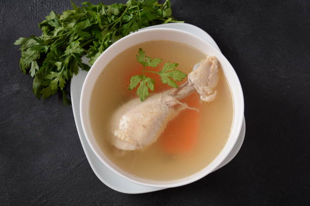 istock Chicken bouillon broth,  boiled meat chicken leg. 1285215777