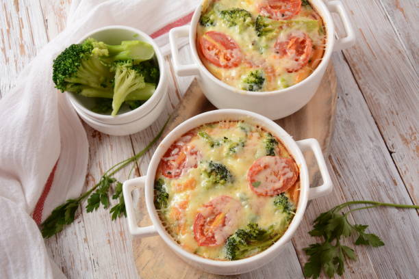 istock Broccoli, cheese and  egg casserole in baking cocottes 1285215825
