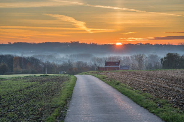 istock sunrise whit an road and a house 1285215902