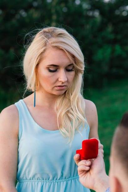 istock Man asking his girlfriend if she wants to marry him. 1285217077