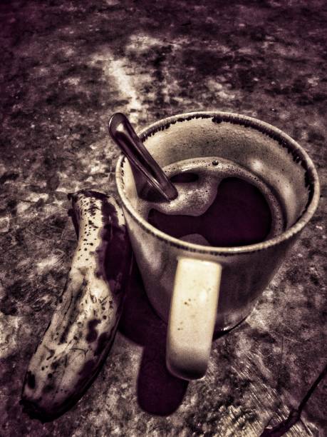 A cup of coffe and bsnana.