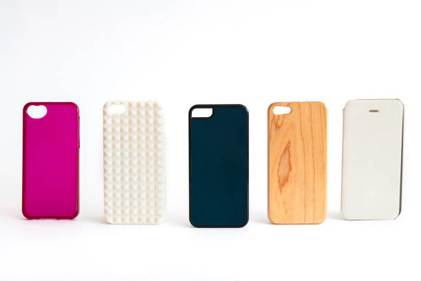 istock Pile of multicolored plastic back covers for mobile phone. Choice of smart phone protector case accessories background. Silicone phone backs on white background 1285221293