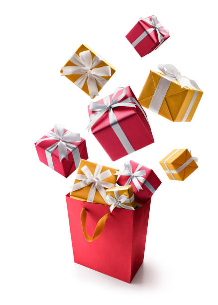 istock Red and gold gift boxes pop out from shopping bag over white background 1285223717