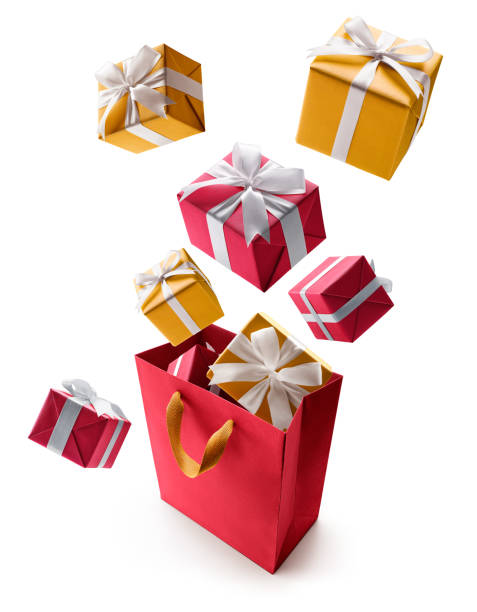 istock Red and gold gift boxes pop out from shopping bag over white background 1285223718