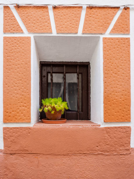istock Tiny window with flowerpot. Jaraiz de la Vera, Spain 1285232315