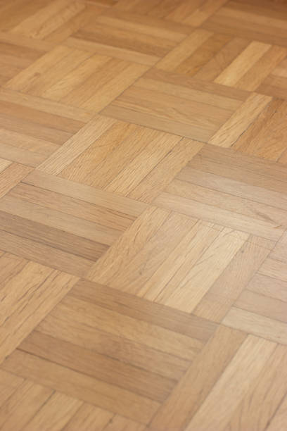 istock Wood tile laminated Parquet flooring top angle perspective arrangement top view 1285233247