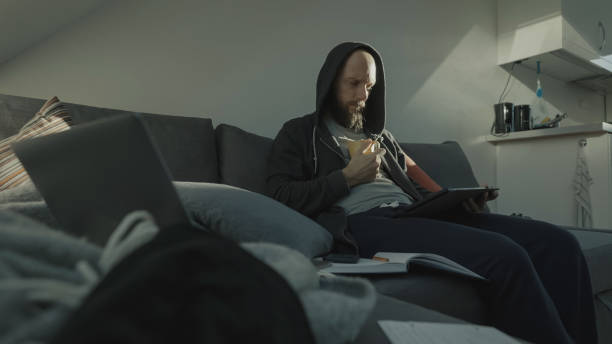 istock Adult student at home: studying home work for University during Covid lockdown 1285236391