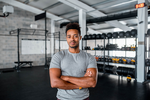 Portrait Of A Black Athlete Standing In The Gym With Arms Crossed