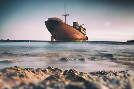 Rotting shipwreck close to the harbor of Lanzarote, Canary Islands, Spain