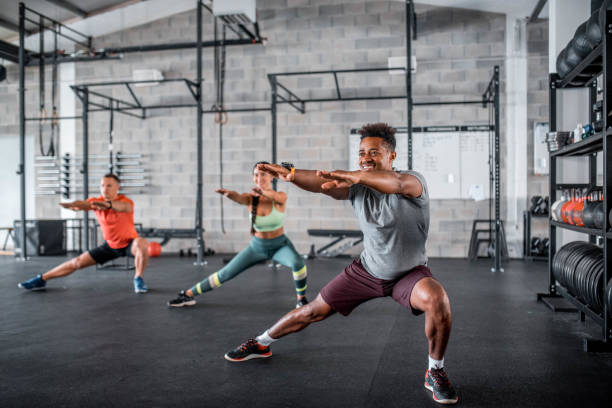 istock Small Group Of Multi Ethnic Group Stretching In The Gym 1285236983