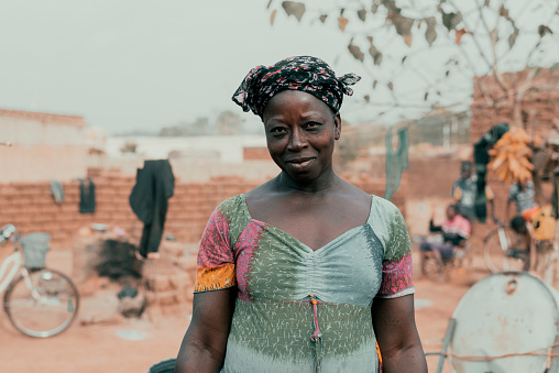 Ouagadougou, Burkina Faso, December 2017. The Sub-Saharan country is mainly made up of people who live in the countryside, where agricultural activities represent the main profession. In this image, part of a photographic documentary, shows a woman employed in an agricultural cooperative working in a field.