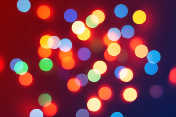 istock Background of colored bokeh. Multi-colored bright blurred texture of lights 1285239302