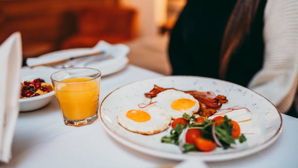 istock Young woman having breakfast at bedroom 1285239326