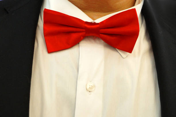 istock red bow tie on a white shirt close up 1285239360