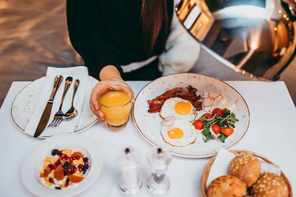 istock Young woman having breakfast at bedroom 1285239410