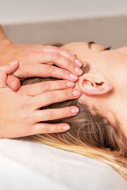 istock Young woman receiving head massage 1285243546