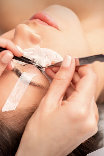 istock Woman having eyelash extension procedure 1285243670