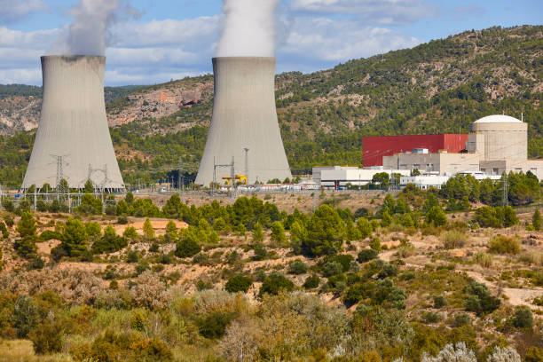 istock Nuclear power plant chimneys with steam. Energy industry 1285245328